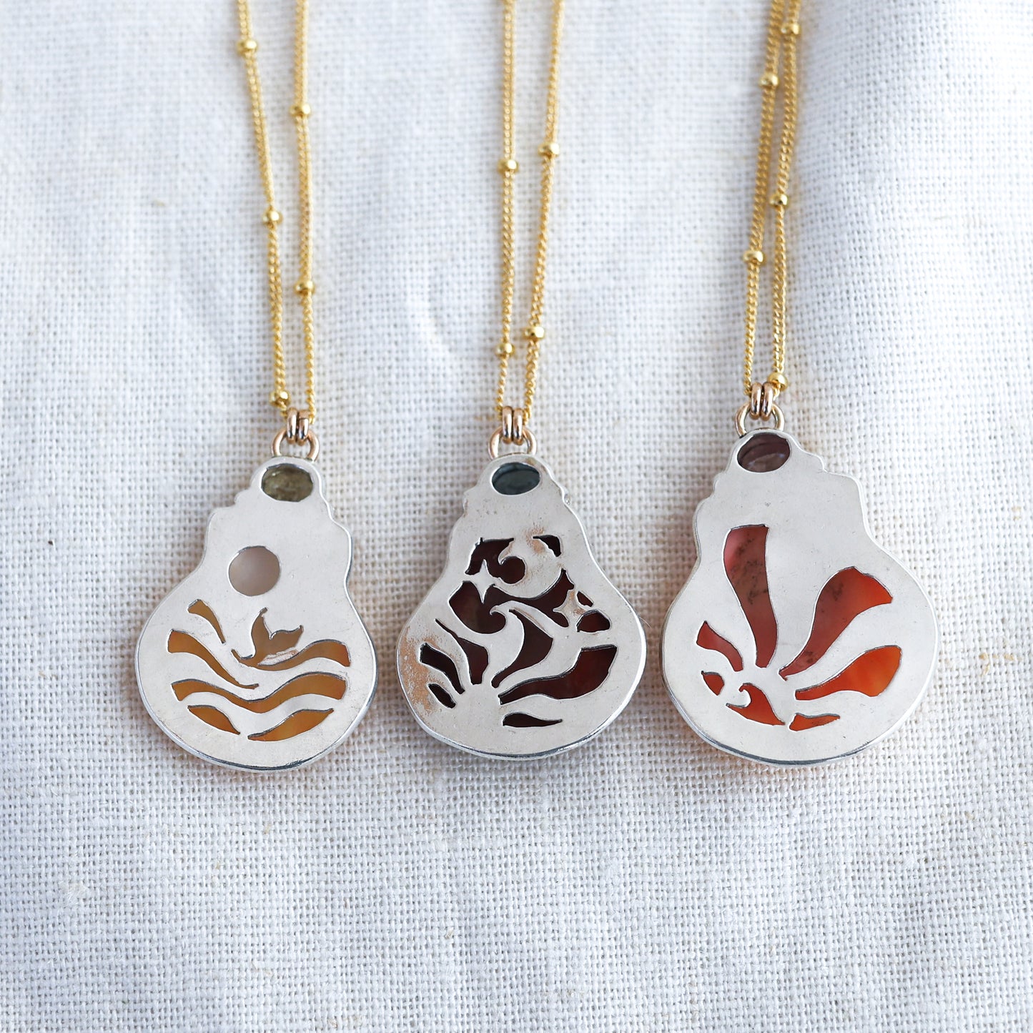 Gold Sunrise Shell and Sapphire Necklaces