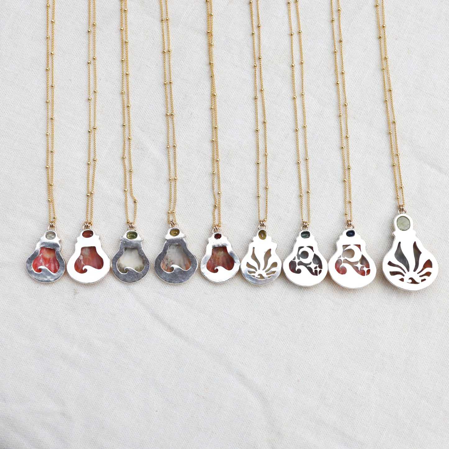 Gold Sunrise Shell and Sapphire Necklaces