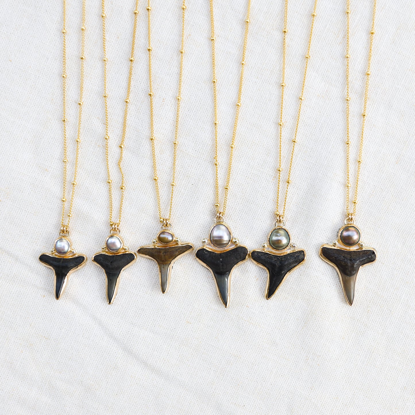 Gold Shark Tooth and Tahitian Pearl Necklaces