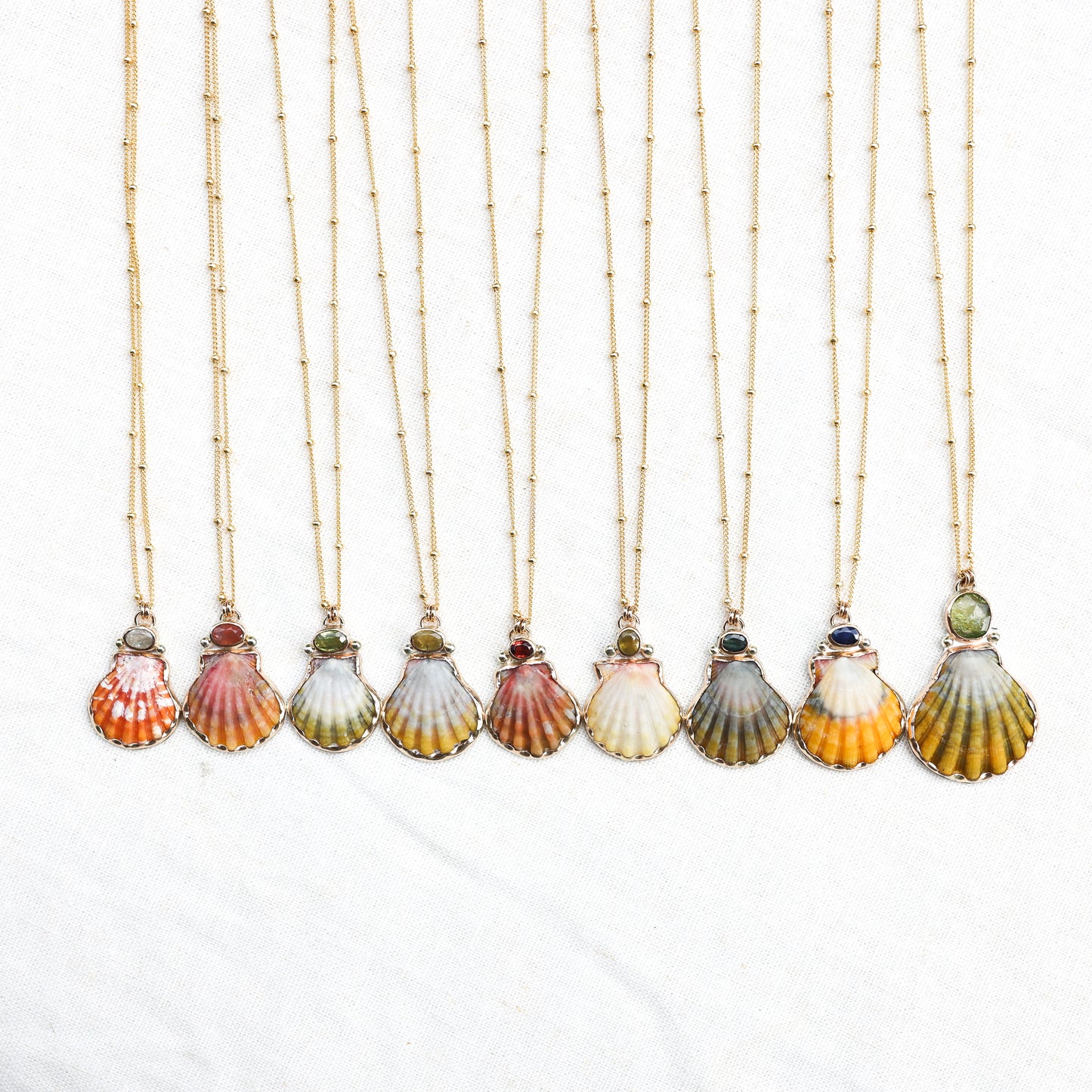 Gold Sunrise Shell and Sapphire Necklaces